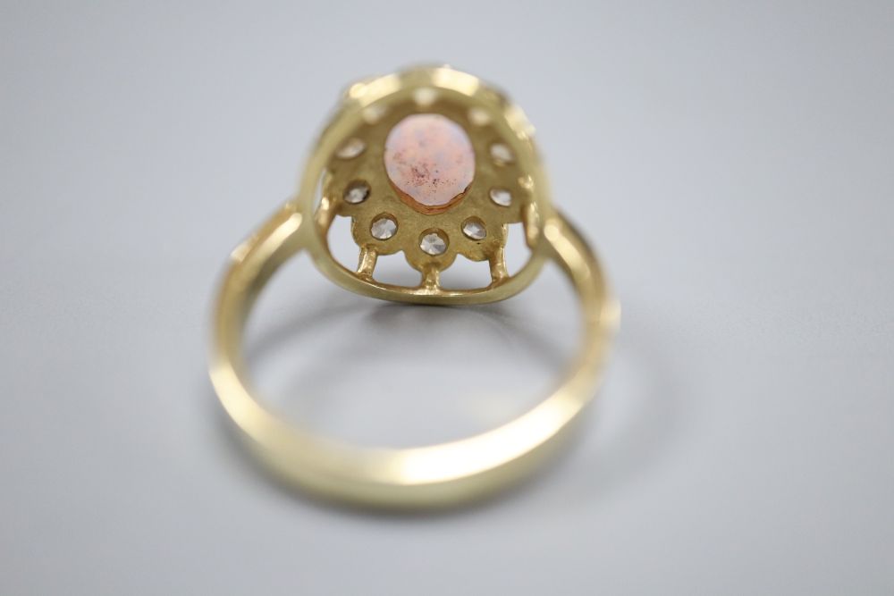 A pair of 585, white opal and paste stud earrings and a similar paste-set bracelet and ring ensuite, gross 21.6g.